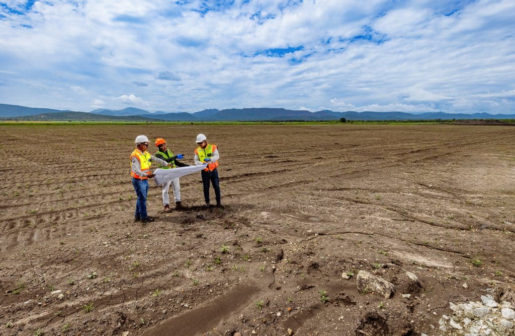 Amandelbult - Open Pit Rehabilitation. L to R are Bongani Phakathi (Senior Foreman - Zizwe), Edgar Chandomba (Production Manager - Anglo) and Abram Mosothoane (Site manager - Zizwe)