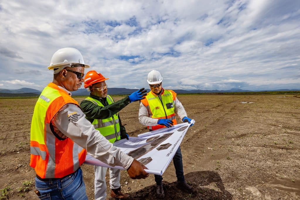 Amandelbult - Open Pit Rehabilitation. L to R are Bongani Phakathi (Senior Foreman - Zizwe), Edgar Chandomba (Production Manager - Anglo) and Abram Mosothoane (Site manager - Zizwe)