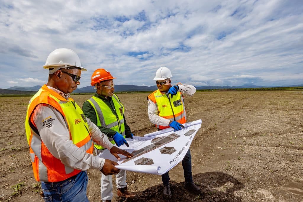 Amandelbult - Open Pit Rehabilitation. L to R are Bongani Phakathi (Senior Foreman - Zizwe), Edgar Chandomba (Production Manager - Anglo) and Abram Mosothoane (Site manager - Zizwe)