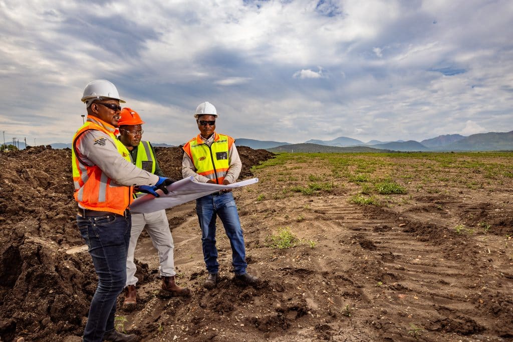 Amandelbult - Open Pit Rehabilitation. L to R are Abram Mosothoane (Site manager - Zizwe), Edgar Chandomba (Production Manager - Anglo)and Bongani Phakathi (Senior Foreman - Zizwe)
